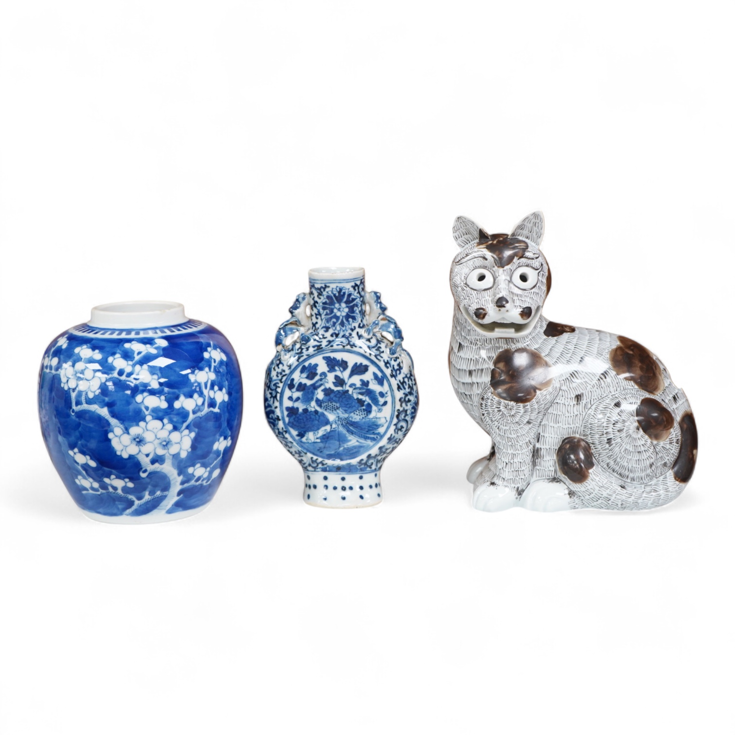 A 19th century Chinese blue and white small moon flask together with a later jar and a Portugese porcelain copy of a Chinese export cat, largest 19cm high